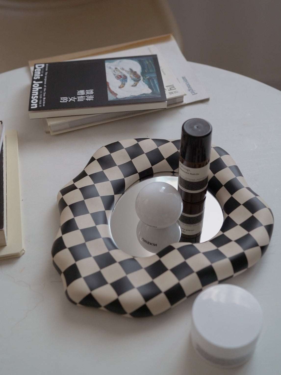 Stylish decorative mirror with checkerboard pattern

