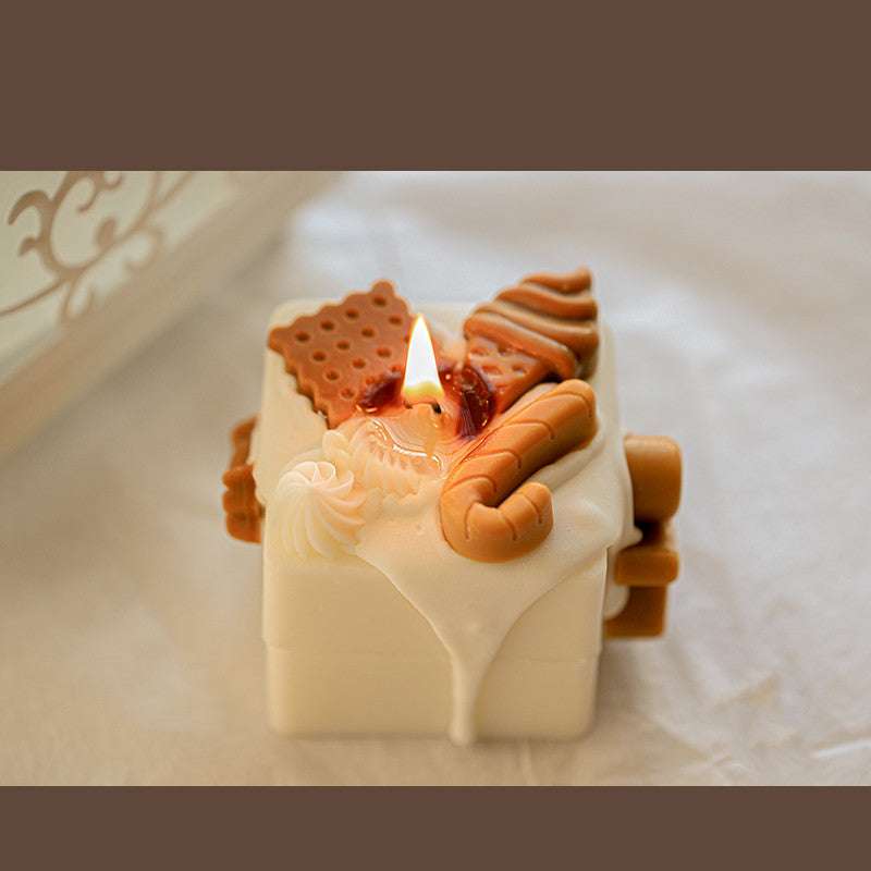 Holiday-themed scented candle shaped like a gingerbread man

